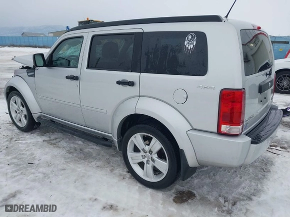 2011 Dodge Nitro Heat with VIN 1D4PU4GX1BW607458, listed as a IAAI auction lot 41279270 with 90,969 mi miles. Bid and sale history available at carsss.com. Image 3.