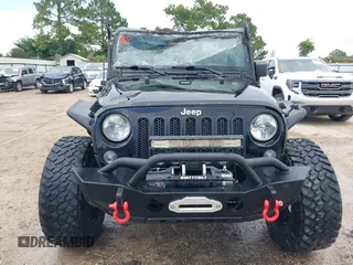 2015 Jeep Wrangler Unlimited Rubicon Hard Rock with VIN 1C4HJWFG0FL674700, listed as a IAAI auction lot 42511949 with 138,370 mi miles and . Bid and sale history available at DreamBid. Image 12.