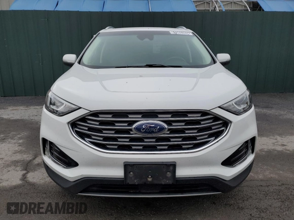 2020 Ford Edge SEL z VIN 2FMPK3J90LBB01559, wystawiony jako Copart lot #61365305 z przebiegiem 120 050 mil mil oraz Czysty tytuł • Clean title. Historia ofert i sprzedaży dostępna na DreamBid. Obrazek 5.