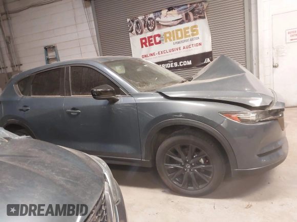 2021 Mazda CX-5 Touring with VIN JM3KFACM9M0379508, listed as a IAAI auction lot 41577251 with 46,519 mi miles. Bid and sale history available at carsss.com. Image 13.