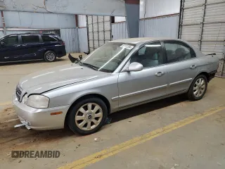 2005 Kia Optima LX z VIN KNAGD128155423463, wystawiony jako Copart lot #87441284 z przebiegiem 143 193 mil mil oraz Szkoda całkowita • Salvage title. Historia ofert i sprzedaży dostępna na DreamBid. Obrazek 1.
