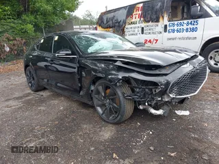 2023 Genesis G70 2.0T z VIN KMTG34TA0PU109208, wystawiony jako IAAI lot #42345552 z przebiegiem 58 139 mil mil oraz . Historia ofert i sprzedaży dostępna na DreamBid. Obrazek 1.