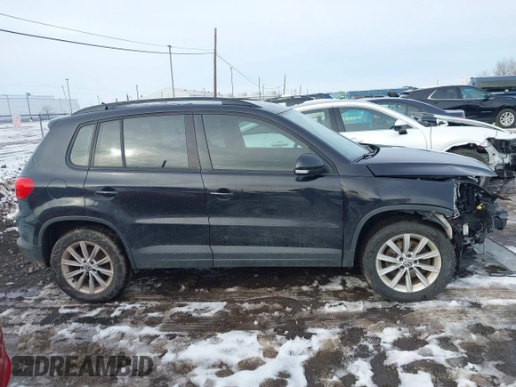 2017 Volkswagen Tiguan S with VIN WVGBV7AX7HK047973, listed as a IAAI auction lot 41197329 with 92,960 mi miles and . Bid and sale history available at DreamBid. Image 13.