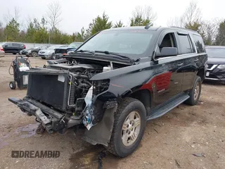 2020 Chevrolet Tahoe LS z VIN 1GNSCAKC1LR177807, wystawiony jako IAAI lot #41482578 z przebiegiem 75 010 mil mil oraz . Historia ofert i sprzedaży dostępna na DreamBid. Obrazek 2.