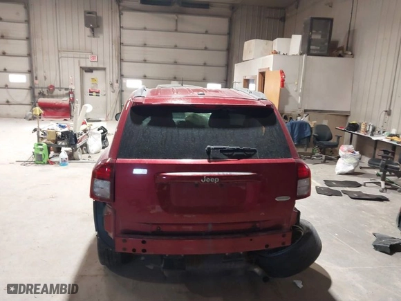 2014 Jeep Compass Latitude with VIN 1C4NJCEB9ED717575, listed as a IAAI auction lot 41532566 with 128,821 mi miles. Bid and sale history available at carsss.com. Image 16.