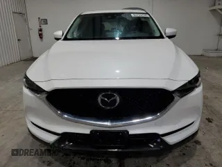 2021 Mazda CX-5 Grand Touring with VIN JM3KFBDM4M1344602, listed as a Copart auction lot 82793724 with 69,322 mi miles and Salvage Title. Bid and sale history available at carsss.com. Image 5.