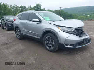 2018 Honda CR-V Touring z VIN 7FARW2H97JE000203, wystawiony jako IAAI lot #42468380 z przebiegiem 54 784 mil mil oraz . Historia ofert i sprzedaży dostępna na DreamBid. Obrazek 1.