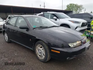 1999 Saturn SL with VIN 1G8ZK5272XZ263163, listed as a IAAI auction lot 42180002 with 138,463 mi miles. Bid and sale history available at carsss.com. Image 1.