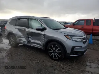 2020 Honda Pilot Touring 8-Passenger with VIN 5FNYF6H9XLB042625, listed as a Copart auction lot 86412804 with 52,061 mi miles and Salvage Title. Bid and sale history available at DreamBid. Image 4.