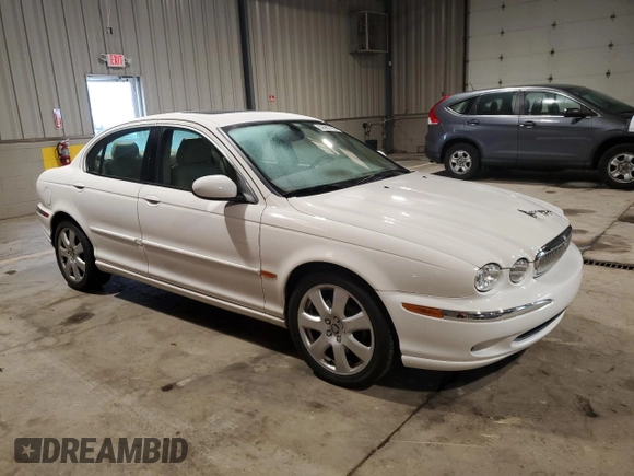 2004 Jaguar X-Type with VIN SAJEA51C34WE06046, listed as a Copart auction lot 56982105 with 69,265 mi miles and Clean Title. Bid and sale history available at DreamBid. Image 4.