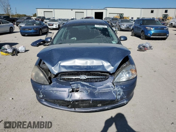 2000 Ford Taurus SE with VIN 1FAFP53U3YG259124, listed as a Copart auction lot 77363344 with 154,889 mi miles and Salvage Title. Bid and sale history available at DreamBid. Image 5.