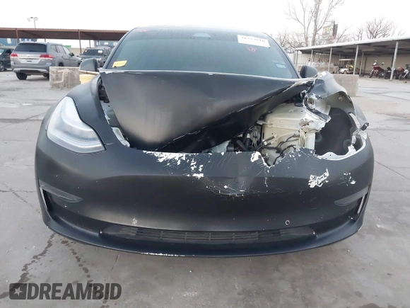 2020 Tesla Model 3 Standard Range Plus with VIN 5YJ3E1EA0LF597761, listed as a IAAI auction lot 41773918 with 89,957 mi miles. Bid and sale history available at carsss.com. Image 11.
