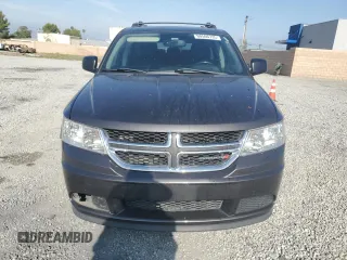 2014 Dodge Journey American Value with VIN 3C4PDCABXET277897, listed as a Copart auction lot 60566735 with 113,343 mi miles and Salvage title. Bid and sale history available at DreamBid. Image 5.
