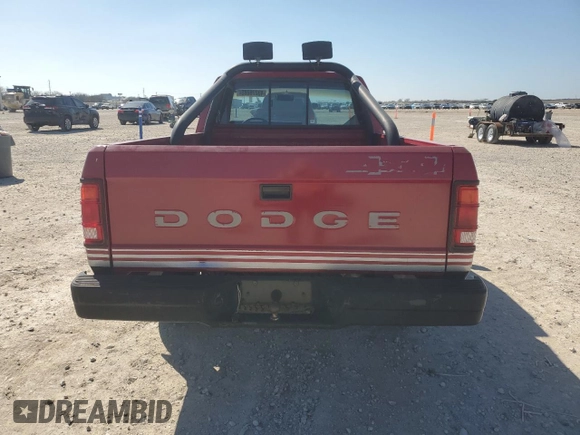 1989 Dodge Dakota z VIN 1B7GG66X6KS127702, wystawiony jako Copart lot #43276685 z przebiegiem 121 862 mil mil oraz Czysty tytuł • Clean title. Historia ofert i sprzedaży dostępna na DreamBid. Obrazek 6.