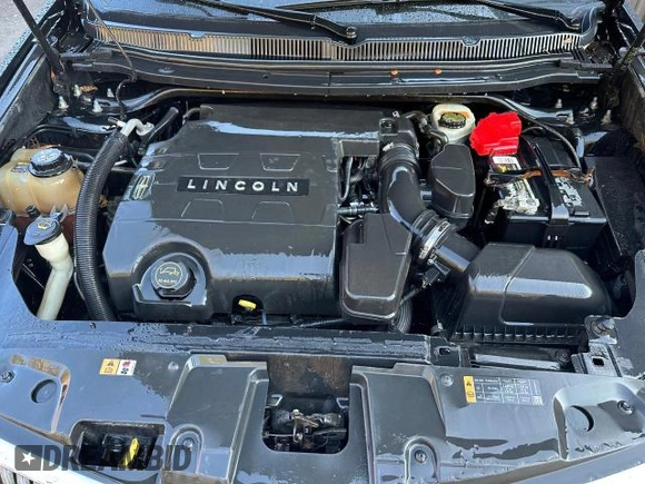 2015 Lincoln MKT with VIN 2LMHJ5NK0FBL03293, listed as a Copart auction lot 77810284 with 115,725 mi miles and Clean Title. Bid and sale history available at DreamBid. Image 7.