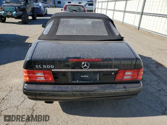 1999 Mercedes-Benz SL-Class with VIN WDBFA68F1XF184891, listed as a Copart auction lot 77082284 with 96,379 mi miles and Salvage Title. Bid and sale history available at carsss.com. Image 6.