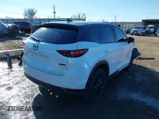 2021 Mazda CX-5 Grand Touring with VIN JM3KFBDM3M0417738, listed as a IAAI auction lot 41308123 with 90,134 mi miles. Bid and sale history available at carsss.com. Image 4.
