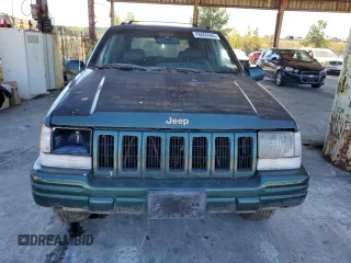 1998 Jeep Grand Cherokee Limited with VIN 1J4GZ78Y8WC261353, listed as a Copart auction lot 76605944 with 156,883 mi miles and Salvage Title. Bid and sale history available at carsss.com. Image 5.