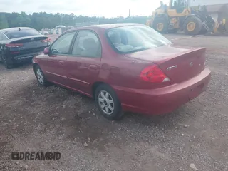 2003 Kia Spectra z VIN KNAFB121X35293054, wystawiony jako IAAI lot #42274932 z przebiegiem 108 978 mil mil oraz . Historia ofert i sprzedaży dostępna na DreamBid. Obrazek 3.