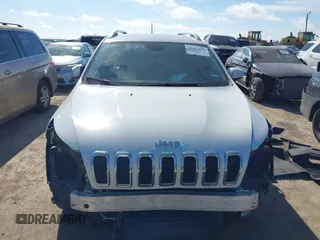2016 Jeep Cherokee Limited with VIN 1C4PJLDB8GW256788, listed as a IAAI auction lot 41657339 with 104,630 mi miles. Bid and sale history available at carsss.com. Image 12.