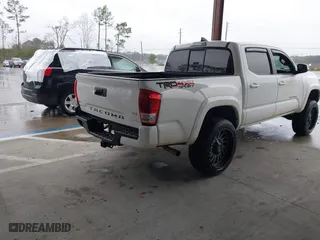 2016 Toyota Tacoma SR with VIN 5TFCZ5AN3GX039919, listed as a IAAI auction lot 41607382 with 107,703 mi miles. Bid and sale history available at carsss.com. Image 4.