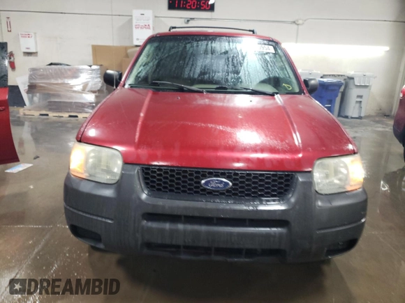 2004 Ford Escape XLS with VIN 1FMYU021X4DA05312, listed as a Copart auction lot 86185954 with 186,010 mi miles and Salvage Title. Bid and sale history available at DreamBid. Image 5.