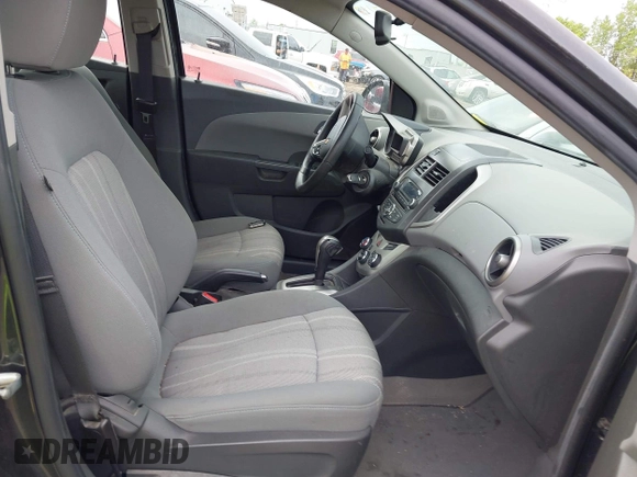 2014 Chevrolet Sonic LT with VIN 1G1JC5SH8E4235864, listed as a IAAI auction lot 42247217 with 150,057 mi miles and . Bid and sale history available at DreamBid. Image 5.
