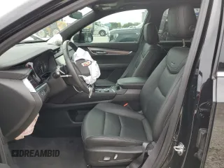 2024 Cadillac XT6 FWD Luxury z VIN 1GYKPAR41RZ734536, wystawiony jako Copart lot #46669655 z przebiegiem 11 916 mil mil oraz Szkoda całkowita • Salvage title. Historia ofert i sprzedaży dostępna na DreamBid. Obrazek 7.