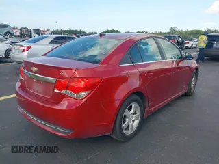 2014 Chevrolet Cruze 1LT z VIN 1G1PC5SB6E7246477, wystawiony jako IAAI lot #42550598 z przebiegiem 98 813 mil mil oraz . Historia ofert i sprzedaży dostępna na DreamBid. Obrazek 4.