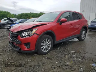 2016 Mazda CX-5 Touring z VIN JM3KE4CY6G0686548, wystawiony jako Copart lot #56391545 z przebiegiem 128 362 mil mil oraz Szkoda całkowita • Salvage title. Historia ofert i sprzedaży dostępna na DreamBid. Obrazek 1.
