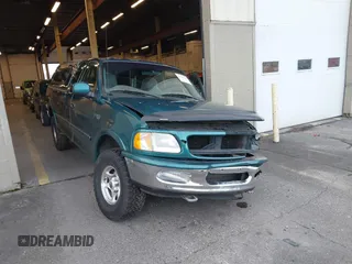 1997 Ford F-150 XL with VIN 1FTEX18L1VKB44867, listed as a IAAI auction lot 41266572 with 105,061 mi miles. Bid and sale history available at carsss.com. Image 6.