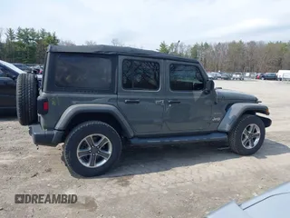 2018 Jeep Wrangler Unlimited Sahara z VIN 1C4HJXEN8JW329816, wystawiony jako IAAI lot #42055851 z przebiegiem 70 298 mil mil oraz . Historia ofert i sprzedaży dostępna na DreamBid. Obrazek 13.
