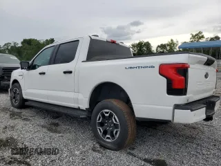 2023 Ford F-150 Lightning Pro z VIN 1FTVW1ELXPWG63466, wystawiony jako Copart lot #59163895 z przebiegiem Nie podano mil oraz Szkody całkowita. Historia ofert i sprzedaży dostępna na DreamBid. Obrazek 2.