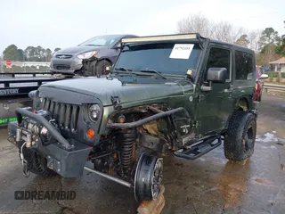 2009 Jeep Wrangler Rubicon z VIN 1J8GA64169L743008, wystawiony jako IAAI lot #41792451 z przebiegiem 142 414 mil mil oraz . Historia ofert i sprzedaży dostępna na DreamBid. Obrazek 2.