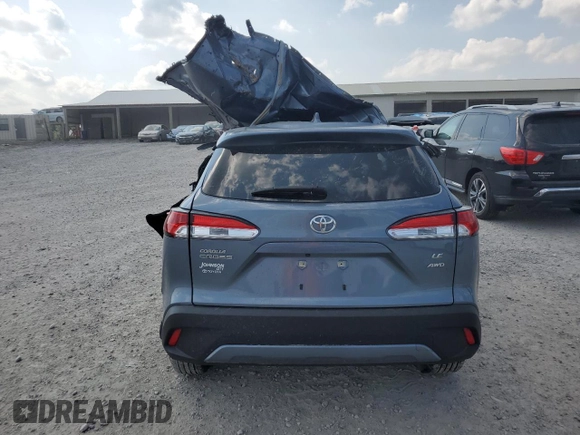 2023 Toyota Corolla Cross LE with VIN 7MUCAABG8PV066528, listed as a Copart auction lot 58902095 with 14,190 mi miles and Salvage title. Bid and sale history available at DreamBid. Image 6.