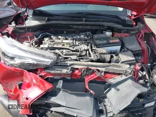 2023 Toyota Corolla Cross XLE z VIN 7MUDAAAG0PV065993, wystawiony jako IAAI lot #42629443 z przebiegiem 16 056 mil mil oraz . Historia ofert i sprzedaży dostępna na DreamBid. Obrazek 10.