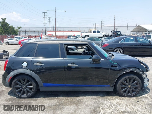2015 MINI Hardtop 4 Door S with VIN WMWXU3C58F2B66601, listed as a IAAI auction lot 42444404 with 76,174 mi miles and . Bid and sale history available at DreamBid. Image 14.