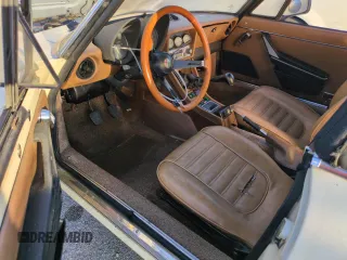 1982 Alfa Romeo Spider Veloce z VIN ZARBA5414C1014655, wystawiony jako Copart lot #74420044 z przebiegiem 63 266 mil mil oraz Szkody całkowita. Historia ofert i sprzedaży dostępna na DreamBid. Obrazek 8.
