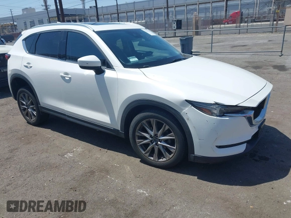 2020 Mazda CX-5 Grand Touring with VIN JM3KFADM9L0821930, listed as a IAAI auction lot 42549986 with 29,929 mi miles and . Bid and sale history available at DreamBid. Image 1.