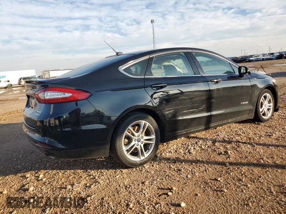 2016 Ford Fusion Titanium Hybrid with VIN 3FA6P0RU6GR356609, listed as a Copart auction lot 79803204 with 69,619 mi miles and Salvage Title. Bid and sale history available at carsss.com. Image 3.