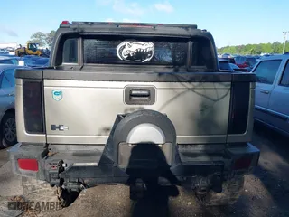 2005 Hummer H2 SUT with VIN 5GRGN22UX5H106653, listed as a IAAI auction lot 42015559 with 180,519 mi miles. Bid and sale history available at carsss.com. Image 16.