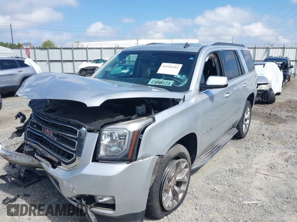 2015 GMC Yukon SLT z VIN 1GKS2BKC0FR100064, wystawiony jako IAAI lot #41941462 z przebiegiem 136 740 mil mil oraz . Historia ofert i sprzedaży dostępna na DreamBid. Obrazek 6.