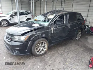 2015 Dodge Journey R/T with VIN 3C4PDDEG3FT555035, listed as a IAAI auction lot 41067936 with 214,244 mi miles and . Bid and sale history available at DreamBid. Image 2.