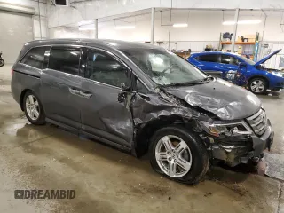 2012 Honda Odyssey Touring with VIN 5FNRL5H98CB028309, listed as a Copart auction lot 57663485 with 233,921 mi miles and Salvage title. Bid and sale history available at DreamBid. Image 4.