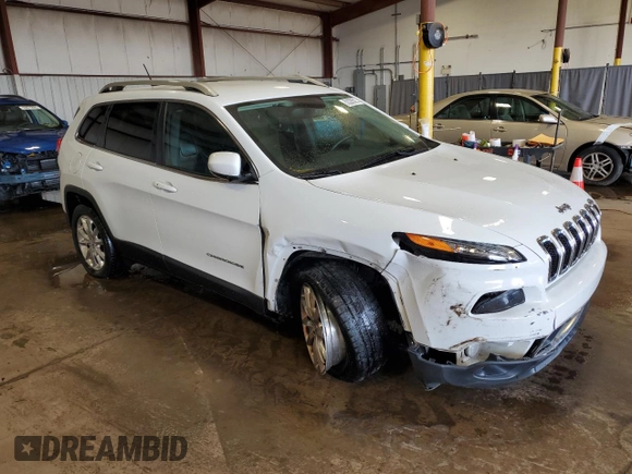 2015 Jeep Cherokee Limited with VIN 1C4PJLDBXFW765909, listed as a Copart auction lot 52293525 with 125,702 mi miles and Salvage Title. Bid and sale history available at DreamBid. Image 4.