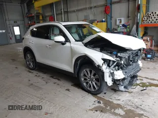 2020 Mazda CX-5 Grand Touring with VIN JM3KFADMXL0742038, listed as a IAAI auction lot 42292400 with 68,339 mi miles and . Bid and sale history available at DreamBid. Image 1.