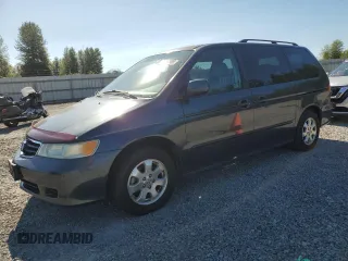 2004 Honda Odyssey EX-L with VIN 5FNRL18054B103902, listed as a Copart auction lot 64077965 with 70,618 mi miles and Salvage title. Bid and sale history available at DreamBid. Image 1.