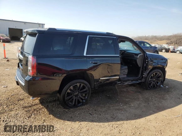 2016 GMC Yukon Denali with VIN 1GKS2CKJ9GR301628, listed as a Copart auction lot 48937035 with 121,863 mi miles and Salvage Title. Bid and sale history available at carsss.com. Image 3.