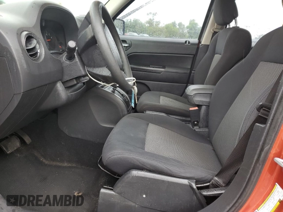 2010 Jeep Patriot Sport z VIN 1J4NF2GB8AD557735, wystawiony jako Copart lot #56532175 z przebiegiem 160 576 mil mil oraz Szkoda całkowita • Salvage title. Historia ofert i sprzedaży dostępna na DreamBid. Obrazek 7.