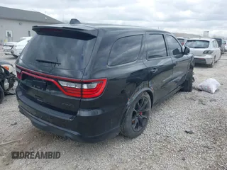 2021 Dodge Durango SRT Hellcat with VIN 1C4SDJH91MC682235, listed as a IAAI auction lot 42029380 with 9,921 mi miles and . Bid and sale history available at DreamBid. Image 4.
